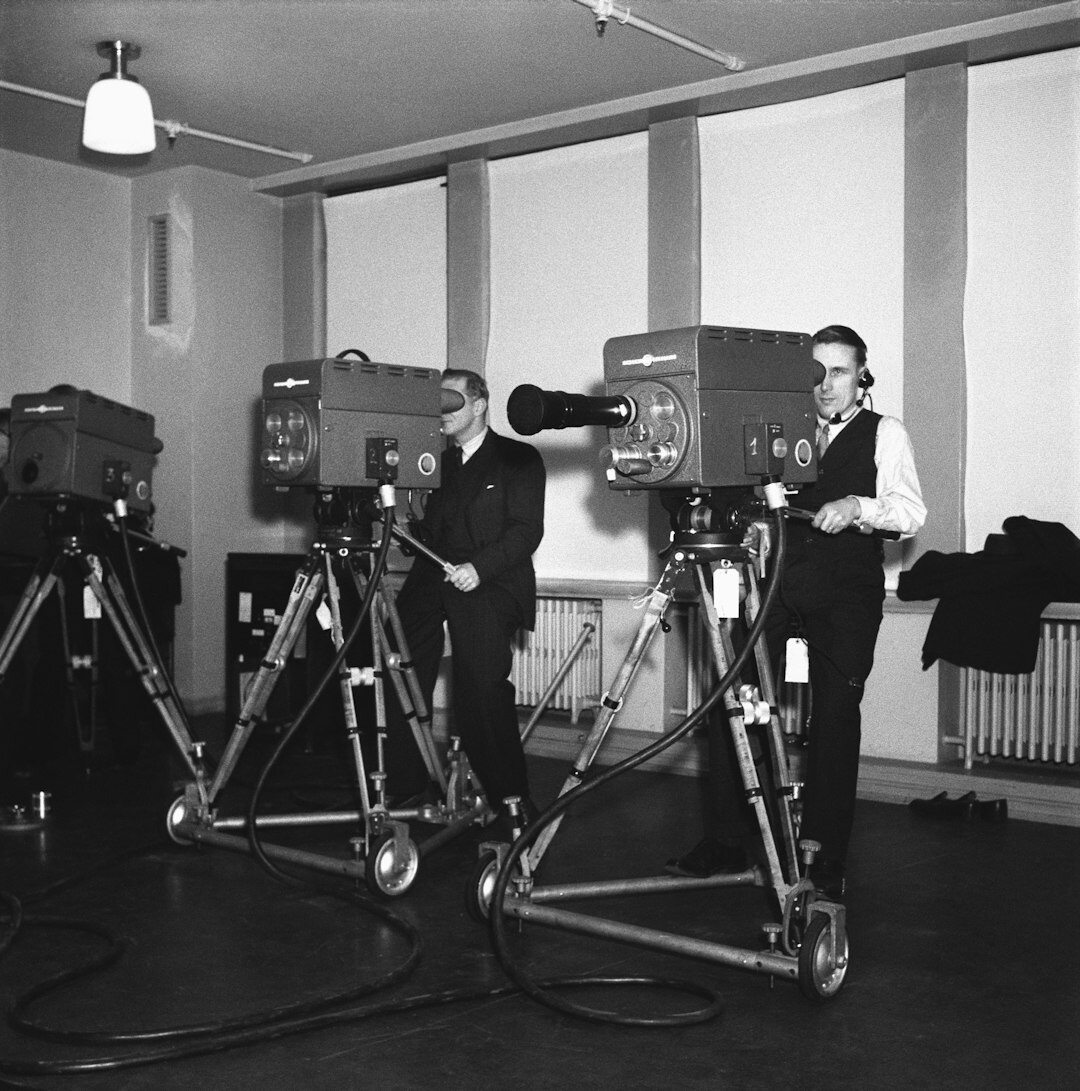 Small video production team standing together